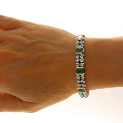 Bracciale in oro giallo e bianco con smeraldi e brillanti