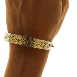 Bracciale rigido in oro giallo e bianco