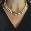 Collana in oro giallo, bianco e diamanti con due fili di perle Akoya