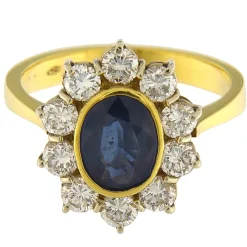 Guidetti | Anello in oro giallo e bianco con zaffiro e contorno di diamanti