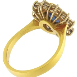 Guidetti | Anello in oro giallo e bianco con zaffiro e contorno di diamanti